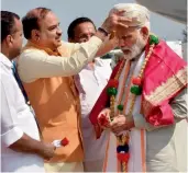  ?? — PTI ?? Prime Minister Narendra Modi being welcomed by Union minister Ananth Kumar on his arrival at Mangalore airport in Karnataka on Sunday.