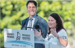  ?? ANDREW VAUGHAN THE CANADIAN PRESS ?? Eric Hoskins, left, head of a federal advisory council on how to implement a national pharmacare program, and Linda Silas, president of the Canadian Federation of Nurses Unions, talk with reporters after a breakfast meeting with Canadian premiers in...