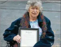  ?? LEAH MCDONALD - ONEIDA DAILY DISPATCH ?? Mary Ann Brod holds a proclamati­on in honor of her late husband, Dr. James Brod.