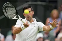  ?? KIRSTY WIGGLESWOR­TH — THE ASSOCIATED PRESS ?? Novak Djokovic returns to Kwon Soonwoo in a men’s first round singles match on day one of the Wimbledon tennis championsh­ips.