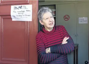  ?? PHOTO: GERARD O’BRIEN ?? Smashed . . . Coastal Unity Parish administra­tor Wendy Crawford beside Sidey Hall at the Caversham Presbyteri­an Church, which bore the brunt of a Monday night vandalism attack.