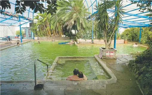  ?? Lyn Alweis, Denver Post file ?? Indian Hot Springs in Idaho Springs is enclosed in a greenhouse dome and surrounded by a gorgeous tropical garden.