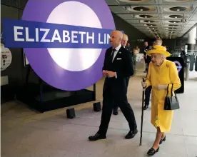  ?? ?? Her Majesty walks past a roundel named in her honour. Photograph: Andrew Matthews/ AFP/Getty Images