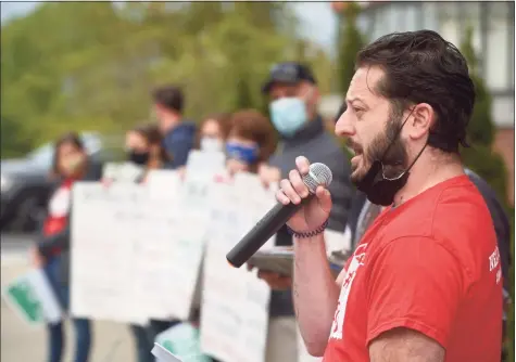  ?? H John Voorhees III / Hearst Connecticu­t Media ?? Josh Richter, a Danbury teacher, parent and homeowner, spoke at a rally Tuesday at Danbury City Hall to demand an increase in the school budget.