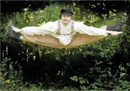  ?? PHOTOS BY BRYAN HAEFFELE, COURTESY OF CLAY & WATTLES THEATER COMPANY. ?? Actor Noah Pyzik does a split leap during a rehearsal for “Fiddler on the Roof” opening July 29. The Clay & Wattles Theater Company production is being held at The Gary The Olivia Theater in Bethlehem.