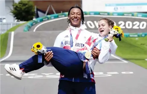  ?? (PA Wire) ?? Hand le with care: the pair celebrate at the Ariake Urban Sports Park