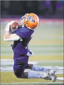  ??  ?? Bishop Gorman wide receiver Shawn Lievense makes a first-quarter catch Friday. Gaels QB Micah Alejado completed 14 passes for 228 yards and four touchdowns.