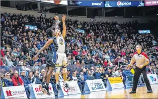  ?? ST. JOHN’S EDGE PHOTO/JEFF PARSONS ?? Carl English gets a shot off despite a KW Titans defender in his face Saturday night at Mile One Centre. English finished the night with 58 points, a career and NBL Canada single-game scoring record.
