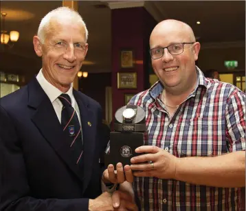  ??  ?? Martin Carroll presents his Captain’s prize in New Ross to Ger Ronan.