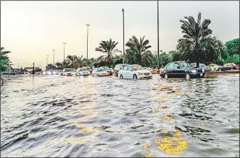  ??  ?? Flooded street in Kuwait is seen on Oct 28. Heavy rainfall in the country on Wednesday leading to suspension of schools
and universiti­es and hampered traffic flow.