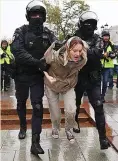  ?? ?? CRACKDOWN Anti-war protester is dragged away at Moscow demo