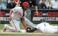  ?? TED S. WARREN — THE ASSOCIATED PRESS ?? Seattle Mariners’ Jarrod Dyson (1) is tagged out trying to steal third by Philadelph­ia Phillies third baseman Maikel Franco, left, in the sixth inning of a baseball game, Wednesday in Seattle. The Phillies won 5-4.