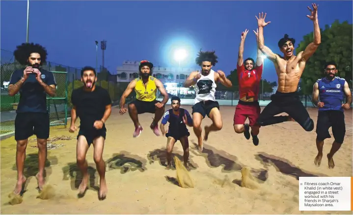  ??  ?? Fitness coach Omar Khalid (in white vest) engaged in a street workout with his friends in Sharjah’s Maysaloon area.