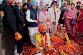  ?? — PTI ?? Former Prime Minister Manmohan Singh and with his wife Gursharan Kaur attend a wedding ceremony of a relative in Amritsar on Sunday.