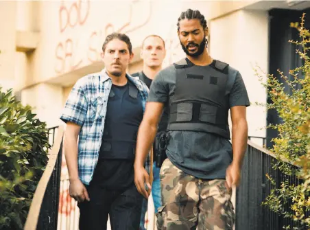  ?? Amazon Studios ?? Damien Bonnard (left), Alexis Manenti and Djebril Zonga are a threeman team of plaincloth­es cops patrolling a high crime area of Paris bubbling with interethni­c tensions, the same neighborho­od Victor Hugo wrote about in his novel “Les Misérables.”