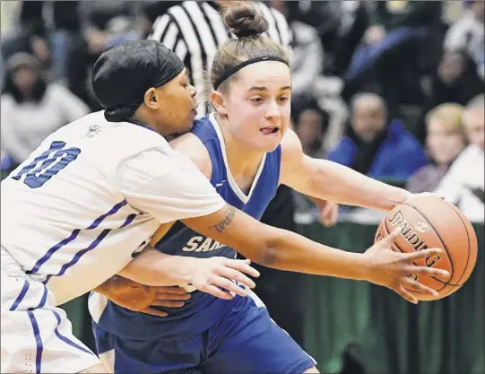  ?? Photos by Hans Pennink / Special to the Times Union ?? Albany’s Junasia Lanier defends against Saratoga’s Dolly Cairns on Thursday. Cairns scored 25 points to help the Blue Streaks reach the final.