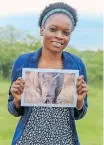  ?? | RIFUMO ?? JABULANI Justine Maluleke with her prized print of a dehorned white rhino. MATHEBULA