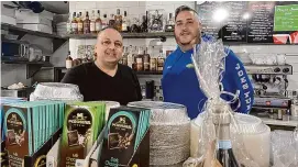  ?? Brian Gioiele/Hearst Connecticu­t Media ?? Caffe Italia owner Lenny Marchisi, left, with friend Matt Sicsico, is celebratin­g the opening of a large outdoor dining area at his eatery at 813 River Road in Shelton.