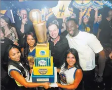  ??  ?? Tony Tran Photograph­y Draymond Green of the Golden State Warriors and team co-owner Joseph Lacob celebrate the Warriors’ NBA championsh­ip Friday at Jewel Nightclub at Aria.