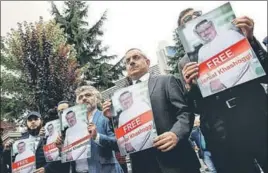 ?? REUTERS ?? Human rights activists and friends of Saudi journalist Jamal Khashoggi hold his pictures during a protest outside the Saudi consulate in Istanbul, Turkey, earlier this week.
