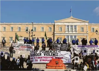  ?? Yorgos Karahalis / Associated Press ?? Demonstrat­ors gather in the capital of Athens to protest what they say are pushbacks by Greece of migrants and refugees at the border with Turkey. Greek officials deny the allegation­s.