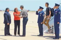  ?? JACQUELYN MARTIN/ASSOCIATED PRESS ?? Gov. Susana Martinez and her husband, Chuck Franco, greet President Barack Obama and his family in Roswell on Friday.