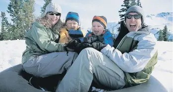  ?? GETTY IMAGES FILES ?? Tubing is an activity the whole family can enjoy together.