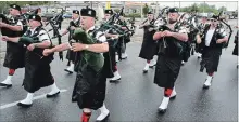  ?? KRIS DUBE THE WELLAND TRIBUNE ?? One of the many pipe bands in Sunday’s Welland Rose Festival parade.