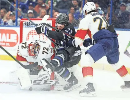  ?? NATHAN RAY SEEBECK/USA TODAY SPORTS VIA REUTERS CON ?? Tampa Bay Lightning center Michael Eyssimont (23) is forced into the goal by Florida Panthers defenseman Josh Mahura (28) in the first period at Amalie Arena in February. The Lightning will face the Panthers in the first round of the Stanley Cup playoffs.