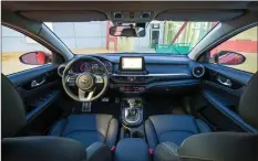  ??  ?? The Forte’s dash is horizontal in appearance with a 20-cm floating screen for the infotainme­nt system in the centre and a two-level tray beneath, the upper one providing a wireless charging pad.