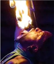  ?? Photo by Mike Eckels ?? Lamount the Human Volcano eats fire during the Kelly Miller Circus at Veterans Park in Decatur Oct. 20.