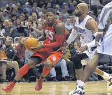  ?? PHELAN M. EBENHACK - THE ASSOCIATED PRESS FILE PHOTO ?? Nets guard Terrence Williams, left, is one of 18former NBA players accused of defrauded the league’s health and welfare benefit plan out of about $4million.