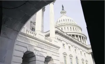  ?? PATRICK SEMANSKY AP ?? The U.S. Capitol Dome is seen from the House carriage entrance on Capitol Hill in Washington.