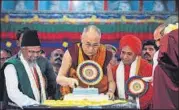  ?? REUTERS ?? The Dalai Lama cuts a cake to celebrate his birthday at Drepung Loseling Monastery in Mundgod, Karnataka, on Wednesday.