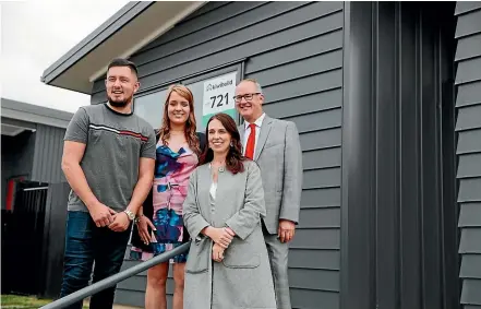  ?? ABIGAIL DOUGHERTY/STUFF ?? Prime Minister Jacinda Ardern and Housing Minister Phil Twyford with new KiwiBuild home owners Derryn Manga and Fletcher Ross in Papakura, Auckland.