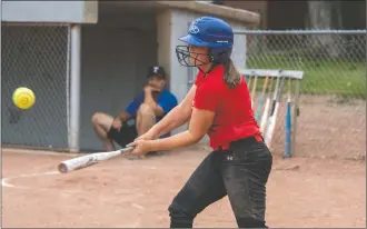  ?? NEWS PHOTO RYAN MCCRACKEN ?? Medicine Hat Thunder U14 catcher Sydney Thompson drives a base hit through the infield during a game against the Medicine Hat Thunder’s U16 squad on Thursday, Aug. 20 in Redcliff.