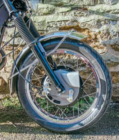  ??  ?? Left: 1971-on BSA Group front forks support the conical hub 2ls brake, itself boosted by the applicatio­n of a pair of longer operating levers