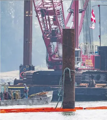  ?? DARRYL DYCK /THE CANADIAN PRESS ?? A barge with a crane will be used in an attempt to lift the George H. Ledcor today. Canadian Coast Guard spokesman Dan Bate said it’s unknown what caused the tugboat to capsize early Tuesday near Vancouver Internatio­nal Airport. All four people aboard the vessel were rescued.