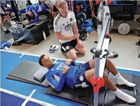  ?? PLUMB IMAGES/LEICESTER CITY/GETTY IMAGES ?? RECOVERY: Left-back Ryan Bertrand, above, looks to be nearing fitness after his serious knee injury. Below, midfielder Kiernan Dewsbury-Hall smiles for the camera during a group jog. Left, James Maddison in the gym