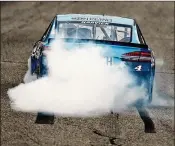  ?? JEFF ZELEVANSKY / GETTY IMAGES ?? Harvick celebrates with a burnout Sunday after winning the Monster Energy NASCAR Cup Series Foxwoods Resort Casino 301.