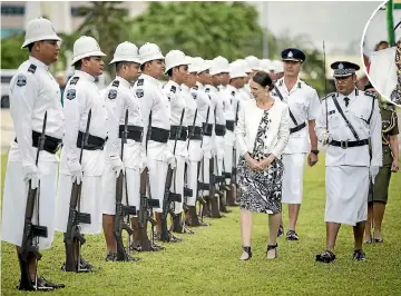  ?? PHOTOS: MICHAEL CRAIG ?? New Zealand Prime Minister Jacinda Ardern inspects the honour guard in front of Samoa’s government buildings in Apia yesterday.