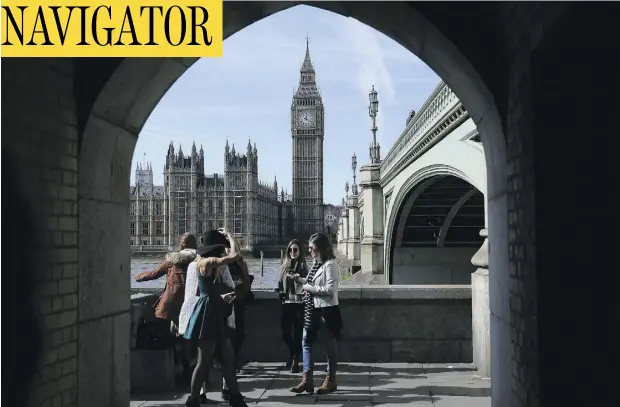  ?? DANIEL LEAL-OLIVAS / AGENCE FRANCE-PRESSE / GETTY IMAGES ?? Commuters cross Westminste­r Bridge, backdroppe­d by Big Ben and the Houses of Parliament in central London.