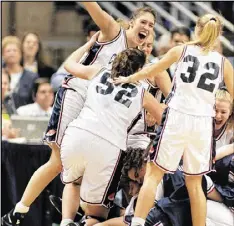  ?? JOHN DUNN / ASSOCIATED PRESS FILE ?? UConn’s Rebecca Lobo (left), celebratin­g with Kara Wolters (52) and Pam Weber (32) after an NCAA Tournament win in 1995, was on the last Huskies team to lose consecutiv­e games.
