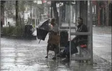  ??  ?? Rain pours, a day after the UK’s second hottest day in July ever recorded, in Wanstead in north east London, on Friday. STEFAN ROUSSEAU/PA VIA AP