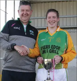  ??  ?? Nicole Fortune of HWH-Bunclody receiving the trophy from Ian Plunkett (Secretary) after last year’s Junior ‘A’ championsh­ip final.