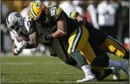  ?? JEFF HAYNES — THE ASSOCIATED PRESS ?? Then Packers middle linebacker B.J. Goodson chases down Raiders running back DeAndre Washington on Oct. 20 in Green Bay, Wis.