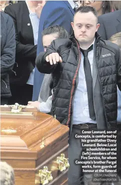  ?? COLM LENAGHAN/ JONATHAN PORTER ?? Conor Leonard, son of Concepta, is comforted by his grandfathe­r Dinny Leonard. Below: Localschoo­lchildren and (left) members of the Fire Service, for whom Concepta’s brother Fergal works, form guards of honour at the funeral