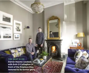  ??  ?? THE HEAT IS ON Darran Heavey (seated) with Eoin O’Calllaghan in front of the fireplace they restored to its former glory
