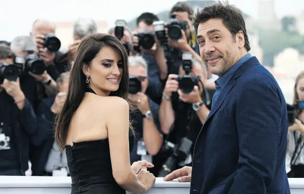  ?? ANNE-CHRISTINE POUJOULAT / AFP / GETTY IMAGES ?? Penelope Cruz and Javier Bardem, married since 2010, pose at a photocall in Cannes for their new film Todos Lo Saben (Everybody Knows).