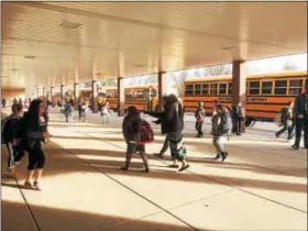  ?? EVAN BRANDT — DIGITAL FIRST MEDIA ?? Students at Lower Pottsgrove Elementary School headed to their buses as normal on Monday afternoon.